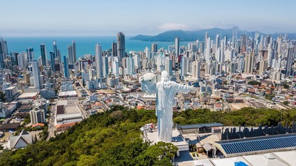 Fototapeta na wymiar Panoramic aerial view of the Cristo Luz statue and buildings in the city of Balneário Camboriú – Santa Catarina - Brazil