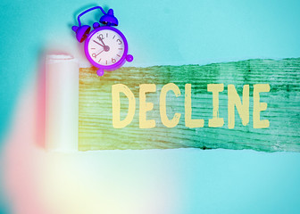 Conceptual hand writing showing Decline. Concept meaning Become smaller fewer less Decrease...