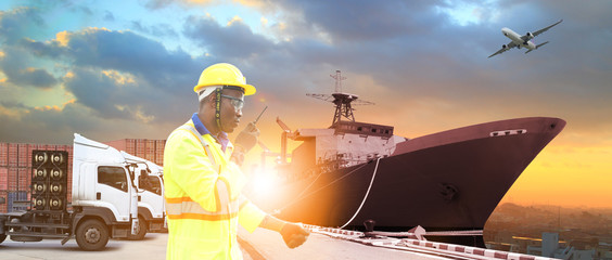 Close up of An African American handsome black engineer he is working in container box yard area for logistic industry
