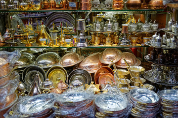 Several Turkish Coffeepots, pans and demitasses from copper, zinc and tin hanging on a street stall...