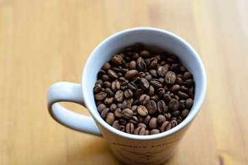 bulk espresso coffee beans in mug