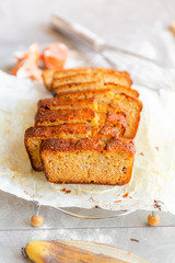Banana Bread with Ingredients on Grey Background