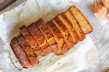 Banana Bread with Ingredients on Grey Background