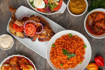 African dishes healthy lifestyle dish with plantain rice and Jollof Rice. Jolof Meal. Egg and plantain. Jelly fish dish with Healthy salad.