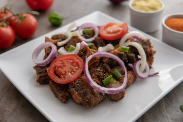 African national dish. Nigerian meal. Healthy lifestyle dish with red onions tomatoes. Salad dish. 