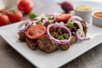 African national dish. Nigerian meal. Healthy lifestyle dish with red onions tomatoes. Salad dish. 