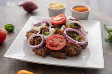 African national dish. Nigerian meal. Healthy lifestyle dish with red onions tomatoes. Salad dish. 
