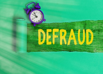 Conceptual hand writing showing Defraud. Concept meaning to trick or cheat someone or something in...