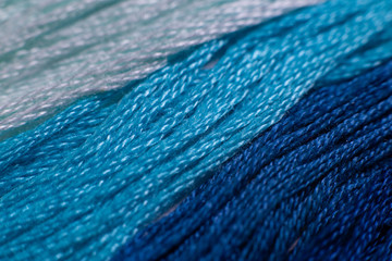 close up of blue fabric threads 