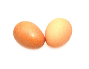 two eggs are isolated on a white background .