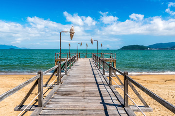 Fototapeta na wymiar Tropical beach resort with lounge chairs and umbrellas, Nha Trang, Vietnam