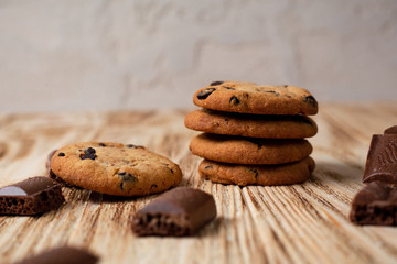 cookies with chocolate on a light wooden table