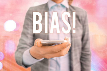 Conceptual hand writing showing Bias. Concept meaning inclination or prejudice for or against one...