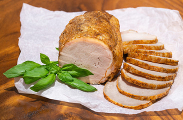 Smoked pork ham. Cold cuts with basil leaves