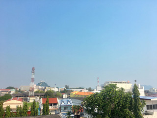 Prachuabkirikhan city in the morning light with many of local building rooftop and moutain behind. January 20, 2019