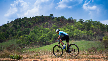 Fototapeta na wymiar Mountain biker cyclists training Mountain trail