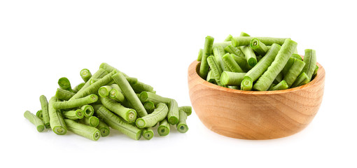 yardlong beans in wooden bowl on white background