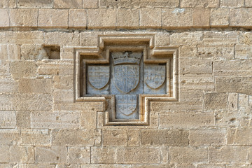 Knight's coat of arms on the Eastern wall of the medieval castle of Kolossi (Cyprus)