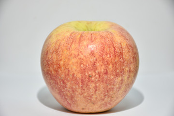 red apple on a wooden table