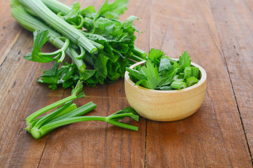 fresh celery on wood background
