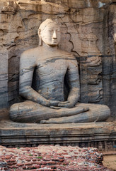 Buddha Sitting granite rock background in Gal vihara Polonnaruwa in Sri Lanka