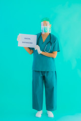 Portrait beautiful young asian doctor woman wear mask show Social distancing on paper board