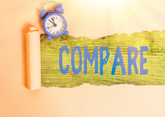 Writing note showing Compare. Business concept for Estimate Measure Note the similarities...