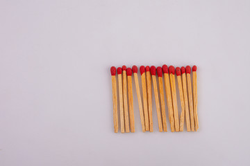 Matches lined up on White background.