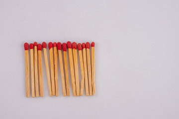 Matches lined up on White background.