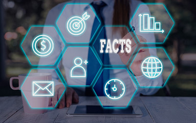 Writing note showing Facts. Business concept for information used as evidence or part of report...