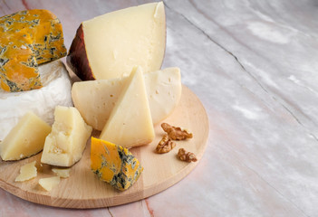 Pieces of Jugas, Camembert  and Shropshire Blue  cheese at white background, isolated