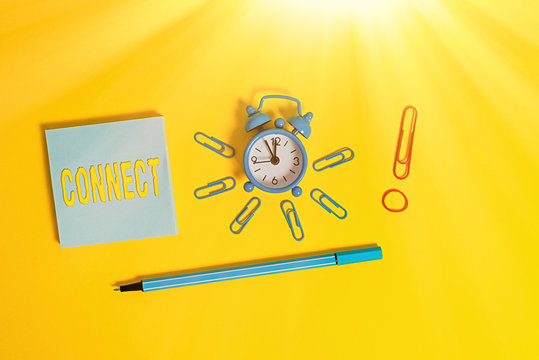 Conceptual hand writing showing Connect. Concept meaning Being together Contact Associate Relate Networking communicate Alarm clock rubber band marker notepad colored background - Powered by Adobe