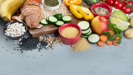 Fototapeta na wymiar Foods high in carbohydrates on grey background