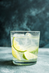 Rum based cocktail caipirinha (variation of cuba libre) on the rustic background. Selective focus. Shallow depth of field.