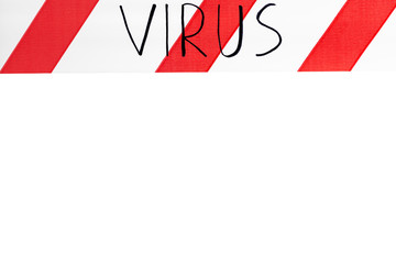 Label virus. Red and white warning tape with the inscription virus close up on an isolated white...