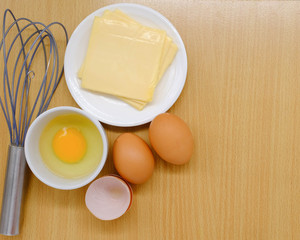 Close-up view of raw chicken eggs on background