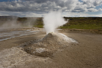 Beautiful colourful Icelandic landscape lava fields mountain geysers zigzag road and moss-covered...