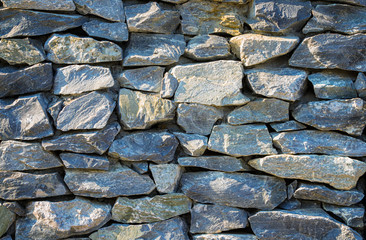 yellow sun light on Granite stone wall background