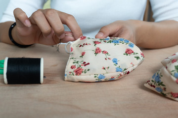 Making DIY masks at home sewing fabric mask handmade cotton protective equipment.