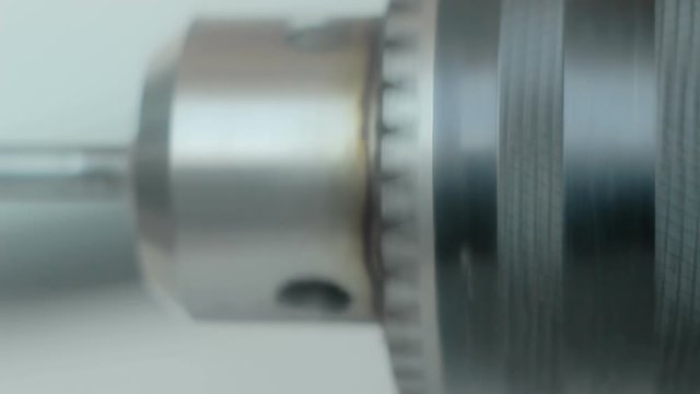 The rotation of the Chuck of the electric drill mounted with a drill