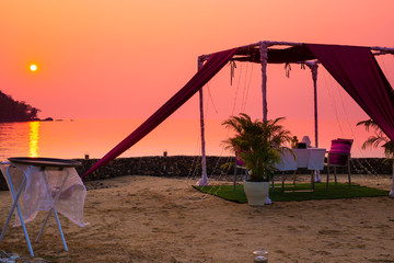 gazebo for relaxing on the beach at sunset