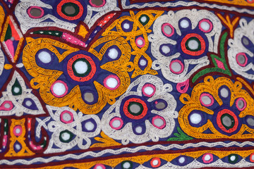 Handmade tribal skirt with embroidery and mirror work,selective focus,embroidery seen in India and Pakistan,pattern arts close up