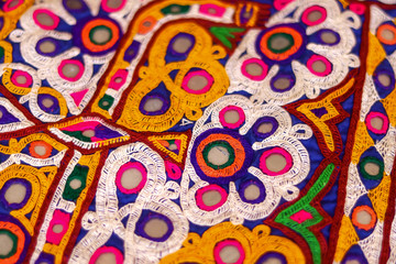 Fototapeta premium Embroidery ethnic flowers neck line flower design close view,traditional Hungarian matyo embroidery motifs.handmade indian embroidery