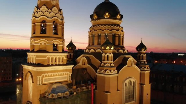 Aerial ascending above a beautiful Orthodox church during sunrise, Saint Petersburg, Russia