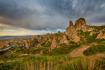 Beautiful sandstone rock formations in Cappadocia, Turkey, under stormy, cloudy, sky