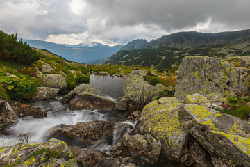 Fototapeta na wymiar Stormy landscape with granite rocks and glacier lakes in the Transylvanian Alps