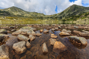 Obraz premium Summer scenery and glacier landscape in the Alps, with beautiful cumulus clouds