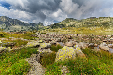 Summer scenery and glacier landscape in the Alps, with beautiful cumulus clouds