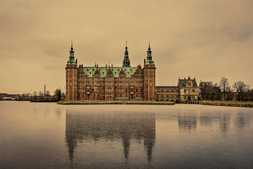 Fototapeta na wymiar Reflections in the thin ice of the lake at Frederiksborg Castle