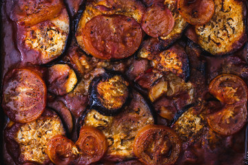 plant-based ingredients, vegan aubergine zucchini bake with tomato sauce and slices